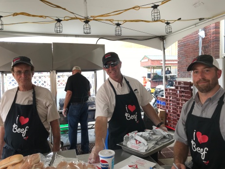 Taking time off for 10 seconds wrapping beef sandwiches are (left to right) Steve Mikels, Dave Fischer and Nick Minton.